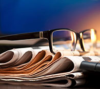 copywriting services website content writing image of glasses on a stack of papers