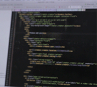 web development company represented by moving image of code being written