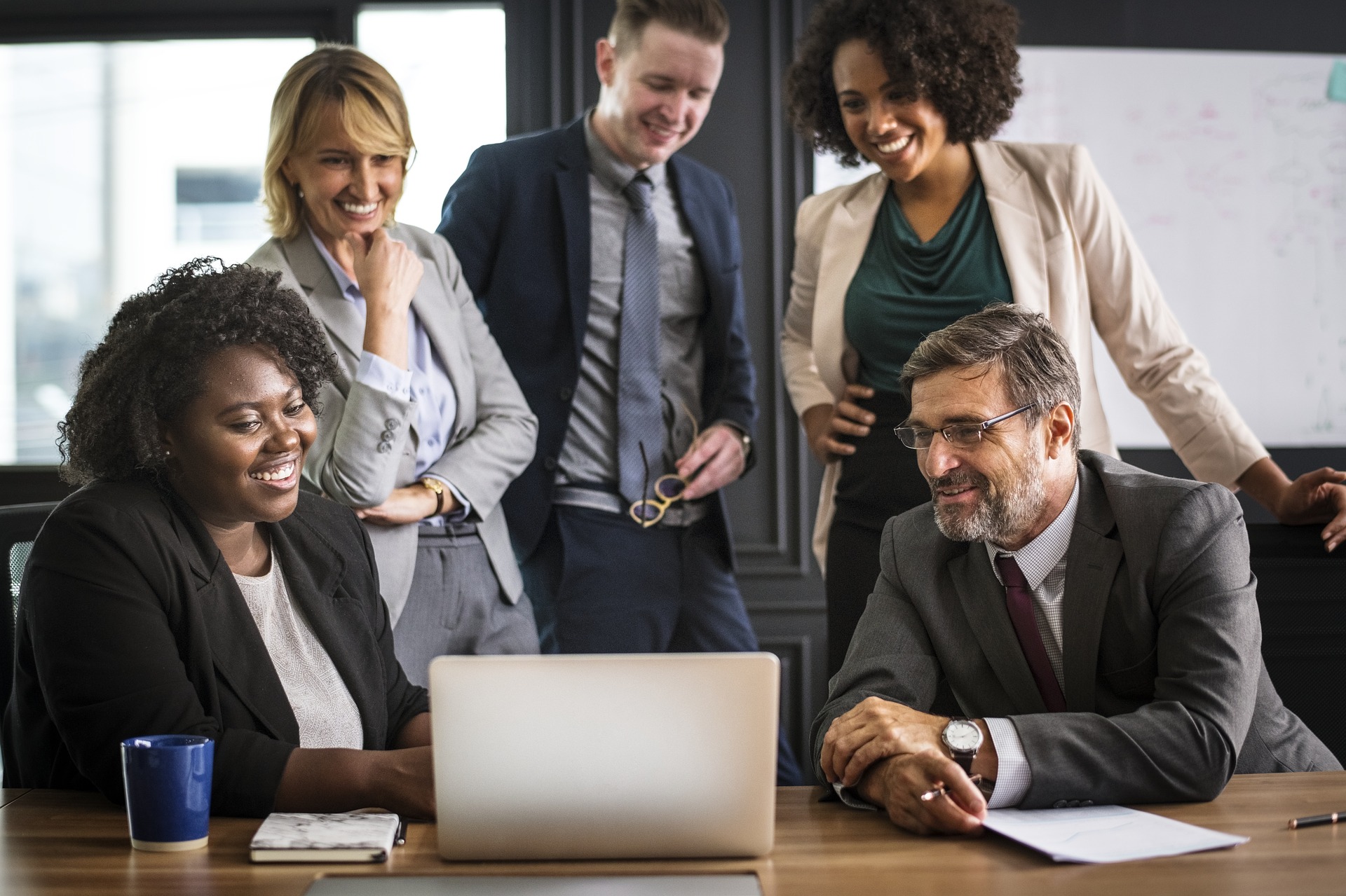 is facebook advertising effective for lawyers image of attorneys smiling while looking at laptop