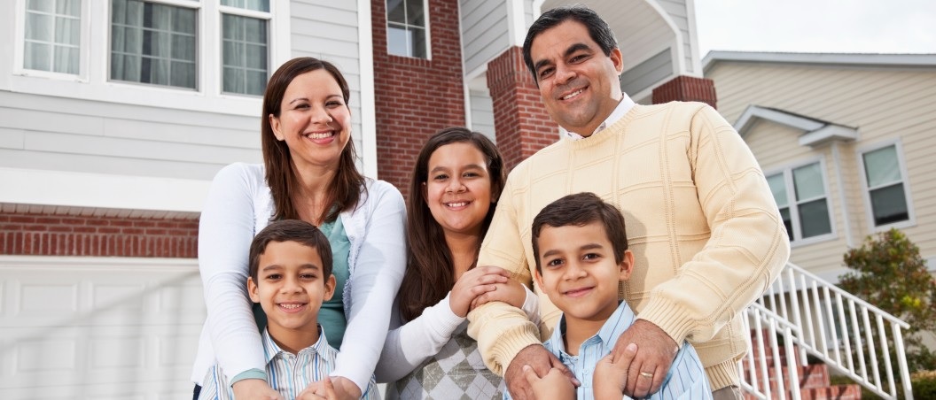 ada website design near syracuse ny image of happy family in front of newly purchased home