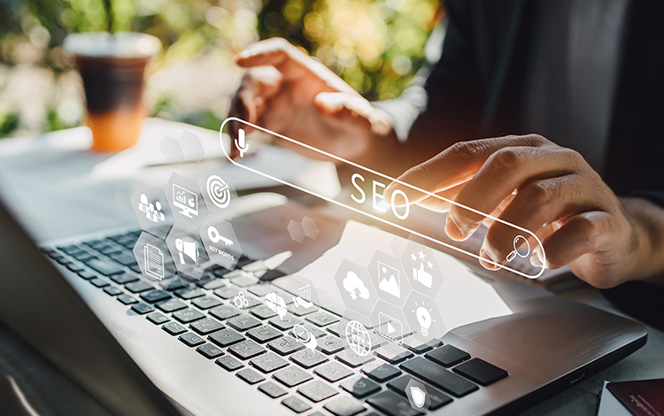 man typing seo searchbar above computer acs web design and seo