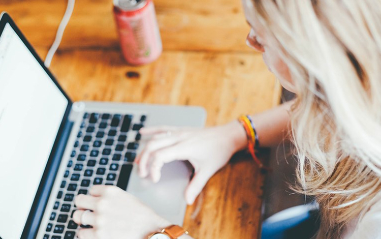 girl on a computer acs web design and seo