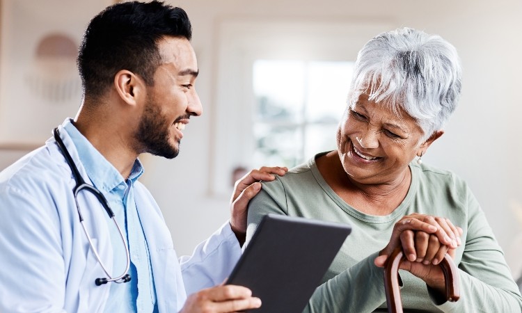 medical marketing and web design services near syracuse image of medical professionals in hospital talking to patient