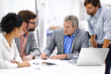 insurance web design image of professionals in a meeting