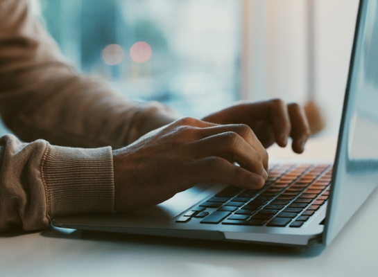 construction website design person searching on laptop
