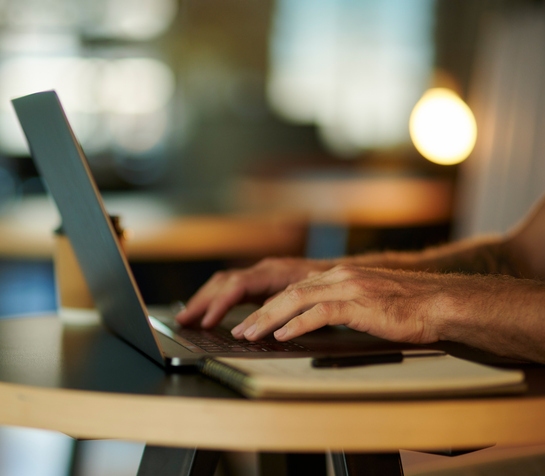 consulting website design with seo hands typing on laptop