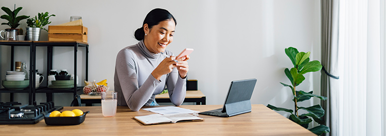 ai digital marketing from acs web design and seo business woman looking at phone smiling