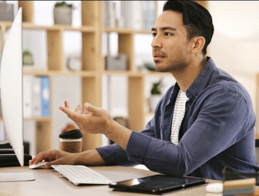 bank website redesign man looking frustrated on computer