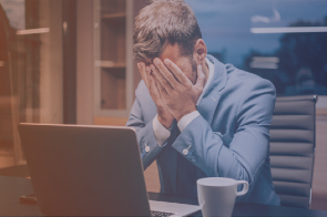 a website builder may cost more than custom web design business owner struggling on computer