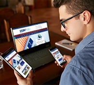 website design employee testing website with desktop tablet and phone