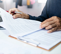 copywriting services website content writing employee reviewing stack of papers