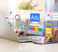 social media marketing computer showing ads and marketing graphics